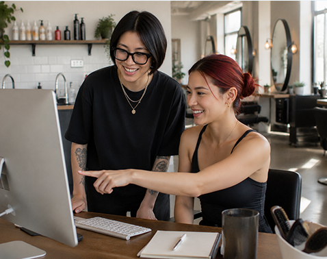Salon business owners reviewing their marketing